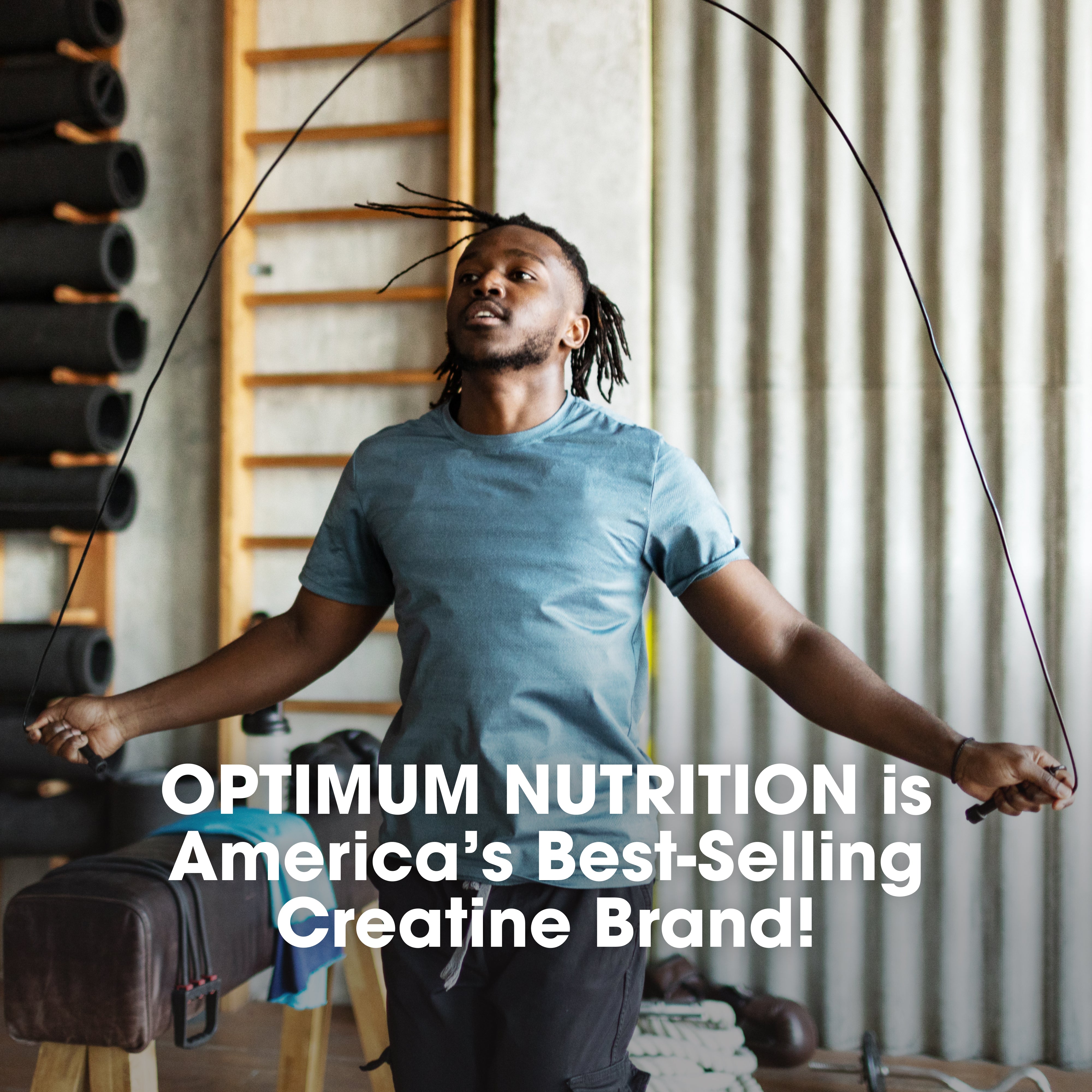 Man skipping rope in a gym with Optimum Nutrition advertisement text overlay