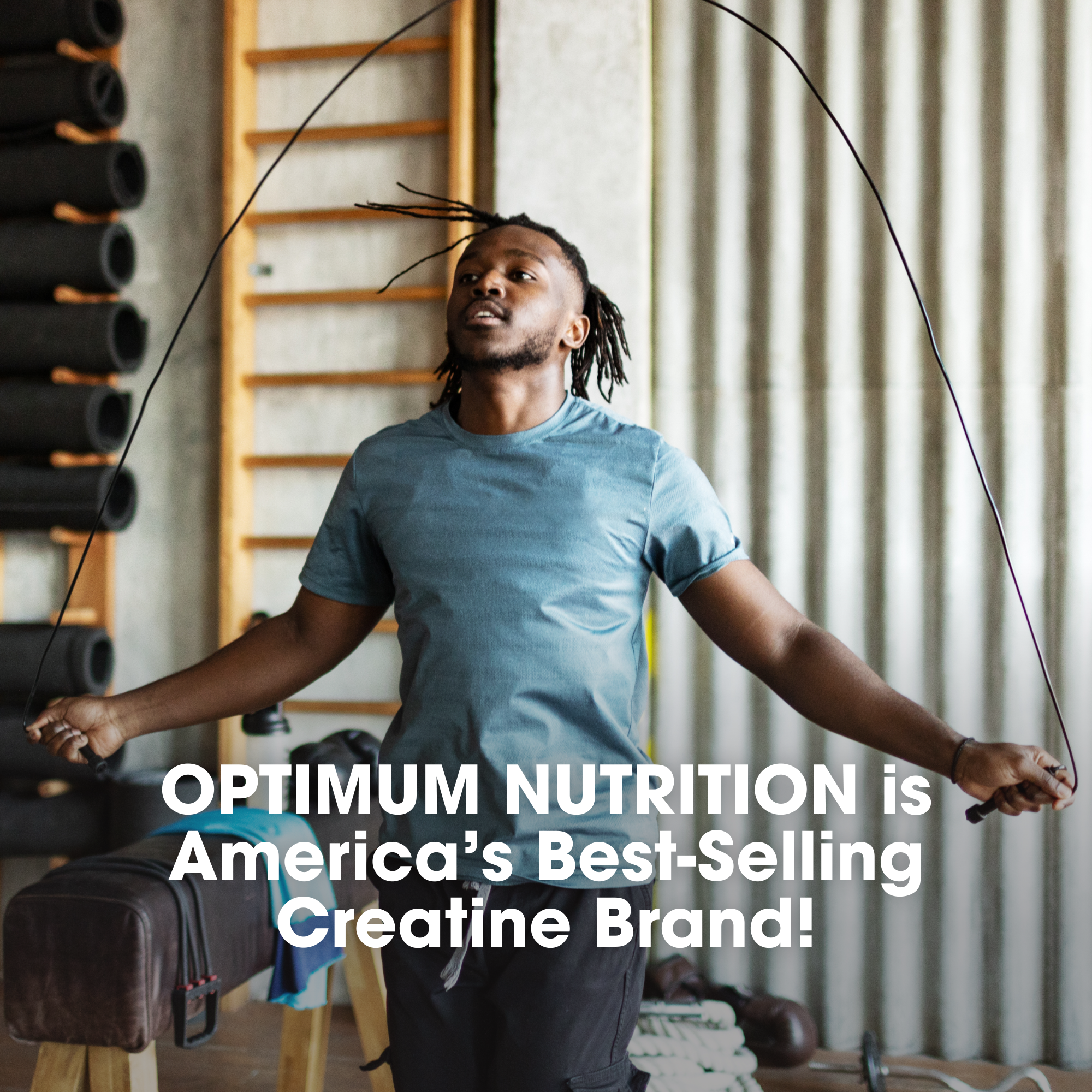 Man skipping rope in a gym with Optimum Nutrition advertisement text overlay